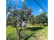 Ranch style home with a large fenced yard and mature trees at 2013 Finland Dr, Spring Hill, FL 34609