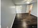 Bedroom with sliding glass doors to a screened porch, and dark laminate floors at 2013 Finland Dr, Spring Hill, FL 34609