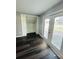 Bedroom with dark hardwood floors and built-in shelving at 2013 Finland Dr, Spring Hill, FL 34609