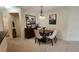 Dining area with dark wood table and off-white chairs at 9048 Southern Charm Cir, Brooksville, FL 34613