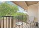 Private balcony with seating and view of parking at 13002 Wedgewood Way # D, Hudson, FL 34667