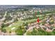 Aerial view of the property and surrounding neighborhood near golf course at 13002 Wedgewood Way # D, Hudson, FL 34667