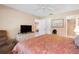 Relaxing Primary bedroom with king-size bed and ensuite bathroom at 13002 Wedgewood Way # D, Hudson, FL 34667