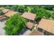 Aerial view of townhouses with brown roofs and lush green landscaping at 13002 Wedgewood Way # D, Hudson, FL 34667