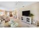 Bright living room featuring comfy seating and built-in shelving at 13002 Wedgewood Way # D, Hudson, FL 34667