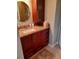 Updated bathroom with granite countertop and wood cabinets at 6009 Sea Ranch Dr # 206, Hudson, FL 34667