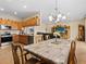 Spacious dining area with a view into the kitchen and living room at 7332 Islander Ln, Hudson, FL 34667