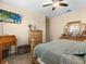 Bright bedroom featuring a TV and ample dresser space at 7332 Islander Ln, Hudson, FL 34667