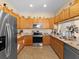 Modern kitchen featuring stainless steel appliances and granite countertops at 7332 Islander Ln, Hudson, FL 34667