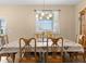 Bright dining room with a large table and chairs, perfect for Gathering gatherings at 7332 Islander Ln, Hudson, FL 34667