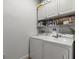Laundry room with washer, dryer, and overhead cabinets at 7332 Islander Ln, Hudson, FL 34667