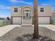 Two-story house with double garage, front porch, and palm tree at 7332 Islander Ln, Hudson, FL 34667