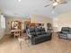 Open living area with comfortable seating and kitchen views at 7332 Islander Ln, Hudson, FL 34667
