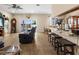 Open floor plan living room with a kitchen bar at 7332 Islander Ln, Hudson, FL 34667