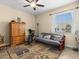 Multipurpose bedroom with exercise equipment and a futon at 7332 Islander Ln, Hudson, FL 34667