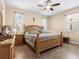 Spacious bedroom with wood furniture and tile floors at 7332 Islander Ln, Hudson, FL 34667