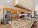 Kitchen with stainless steel appliances and granite counters at 7332 Islander Ln, Hudson, FL 34667
