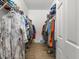 Large walk-in closet with plenty of hanging and shelving space at 7332 Islander Ln, Hudson, FL 34667