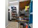 Well-organized pantry with ample shelving for storage at 7332 Islander Ln, Hudson, FL 34667