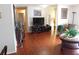 Living room with hardwood floors, large TV, and ample space at 10526 Mira Vista Dr, Port Richey, FL 34668