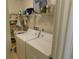 Laundry room with washer, dryer, and storage shelves at 10526 Mira Vista Dr, Port Richey, FL 34668