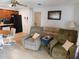 Open living room with comfortable seating and kitchen view at 10526 Mira Vista Dr, Port Richey, FL 34668