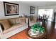 Bright living room features hardwood floors, a dining area, and ample natural light at 10526 Mira Vista Dr, Port Richey, FL 34668