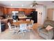Kitchen with wooden cabinets and a breakfast table at 10526 Mira Vista Dr, Port Richey, FL 34668