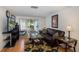 Gathering room with a view of the backyard and pool at 12709 Clock Tower Pkwy, Hudson, FL 34667