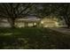 House exterior showcasing a single story home with mature trees at 12709 Clock Tower Pkwy, Hudson, FL 34667