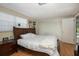 Large bedroom with a king-size bed and access to the pool at 12709 Clock Tower Pkwy, Hudson, FL 34667