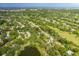 Aerial view showing property location near golf course and water at 12709 Clock Tower Pkwy, Hudson, FL 34667