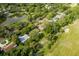 Aerial view showing home's location near golf course and lake at 12709 Clock Tower Pkwy, Hudson, FL 34667