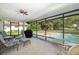 Relaxing screened lanai with pool and yard views at 12709 Clock Tower Pkwy, Hudson, FL 34667