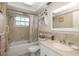 Bathroom with tub, shower, and updated vanity at 12709 Clock Tower Pkwy, Hudson, FL 34667