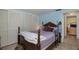 Bedroom with a wooden bed and closet at 12709 Clock Tower Pkwy, Hudson, FL 34667