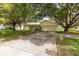 Single story home with driveway and mature landscaping at 12709 Clock Tower Pkwy, Hudson, FL 34667