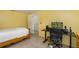 Bedroom with a desk, chair, and a bed at 12709 Clock Tower Pkwy, Hudson, FL 34667