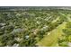 Aerial view of property near golf course and lake at 12709 Clock Tower Pkwy, Hudson, FL 34667