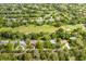 Aerial view showing home with pool, near golf course at 12709 Clock Tower Pkwy, Hudson, FL 34667