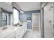 Elegant bathroom with double vanity and shower at 8731 Starry Night Ter, Parrish, FL 34219
