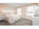 Spacious bedroom with a king-size bed and large windows at 8731 Starry Night Ter, Parrish, FL 34219