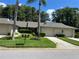 Front view of a charming villa with a well-maintained lawn and two-car garage at 3275 Lori Ln # 5, New Port Richey, FL 34655