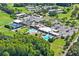 Aerial view of Seven Springs amenities, including pools and tennis courts at 3275 Lori Ln # 5, New Port Richey, FL 34655