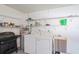 Laundry room with washer, dryer, shelving, and extra storage at 3275 Lori Ln # 5, New Port Richey, FL 34655