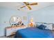 Serene bedroom featuring a double bed, dresser, and circular mirror at 3275 Lori Ln # 5, New Port Richey, FL 34655