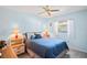 Cozy bedroom with a double bed, nightstands, and ceiling fan at 3275 Lori Ln # 5, New Port Richey, FL 34655