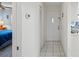 Bright entryway with tile flooring leading to a bedroom and kitchen at 3275 Lori Ln # 5, New Port Richey, FL 34655