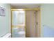 Bright bathroom with a shower stall and gold-framed glass door at 3275 Lori Ln # 5, New Port Richey, FL 34655
