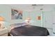 Bright bedroom with king-size bed and lovely wall art at 3275 Lori Ln # 5, New Port Richey, FL 34655